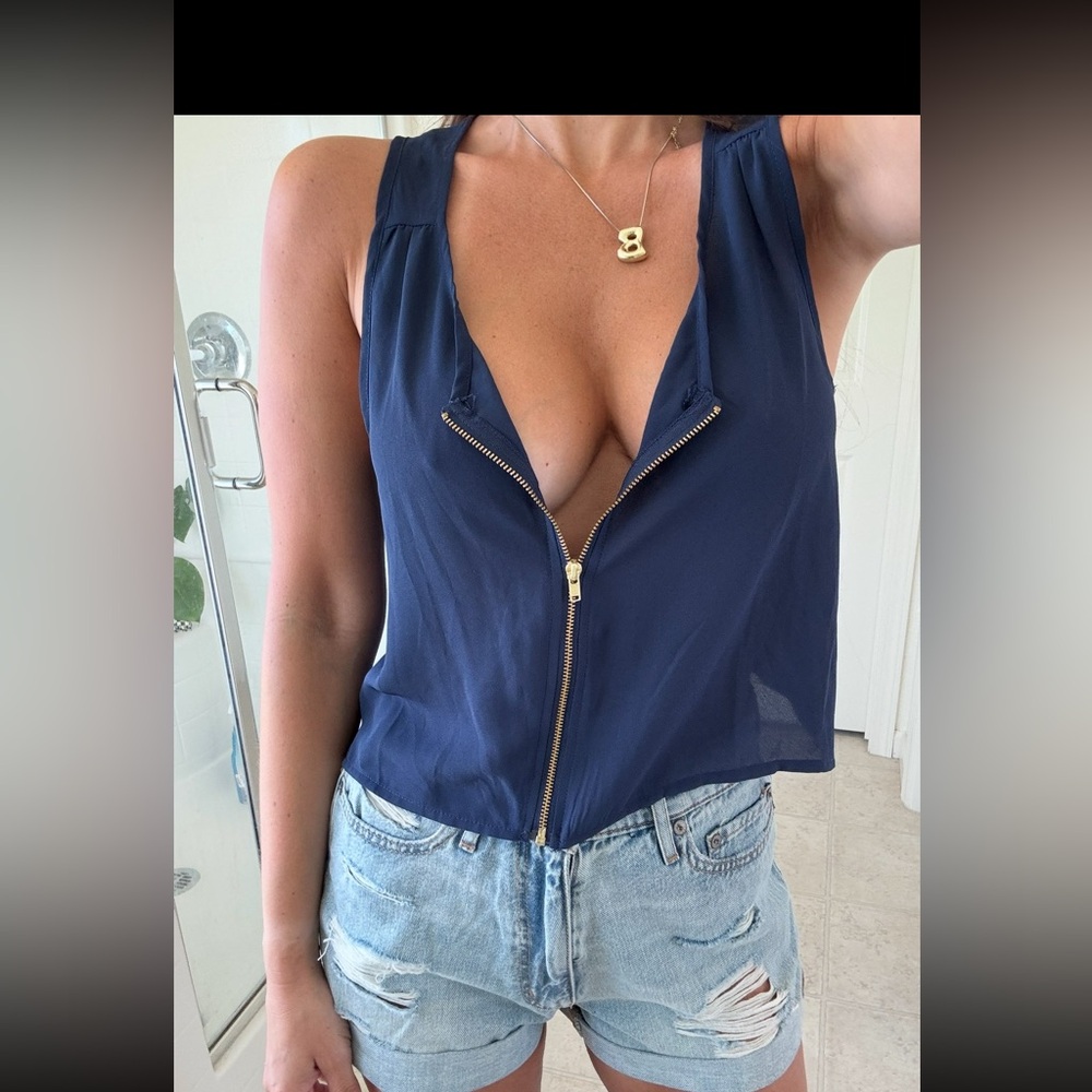 Navy blue zip up tank.